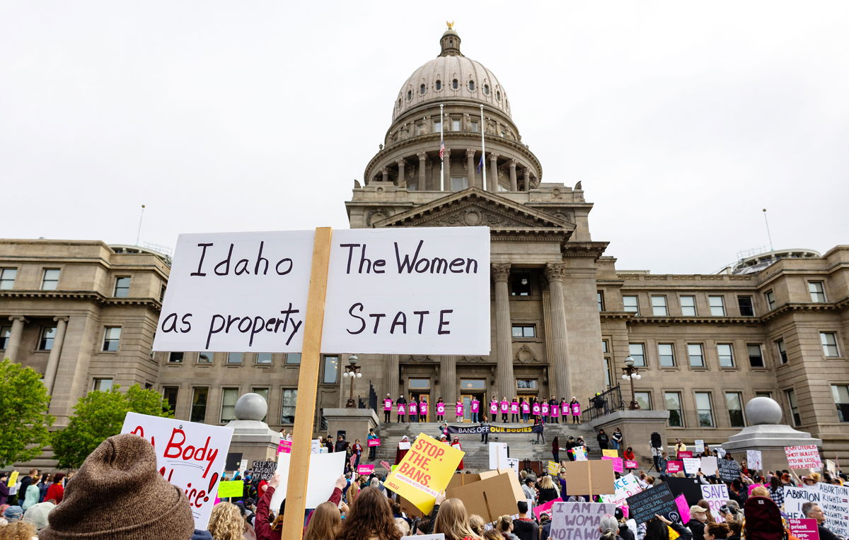 <i>Sarah A. Miller/AP/FILE</i><br/>An attendee at a rally for abortion rights holds a sign outside the Idaho Statehouse in downtown Boise on May 14.