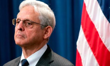 Attorney General Merrick Garland attends a news conference at the Department of Justice