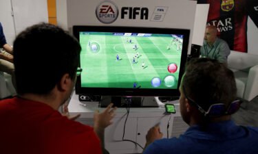 People play Electronic Arts' "FIFA" video game at the Microsoft Xbox booth at the Electronic Entertainment Expo