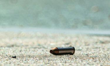 A bullet casing is seen at the crime scene after at least three people were killed and 11 injured in a shooting in the busy South Street area of Philadelphia on Sunday