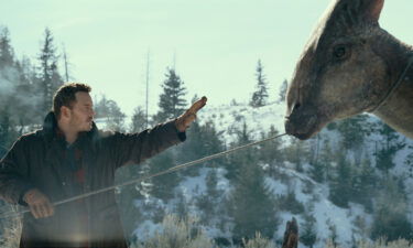 Chris Pratt and a Parasaurolophus in 'Jurassic World: Dominion.'