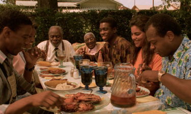 A scene from "Mississippi Masala" shows the family sharing a meal together.