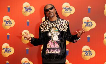 US rapper Snoop Dogg arrives for the MTV Movie and TV Awards at the Barker Hangar in Santa Monica