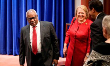 Associate Supreme Court Justice Clarence Thomas and his wife and conservative activist Virginia Thomas arrive at the Heritage Foundation on October 21