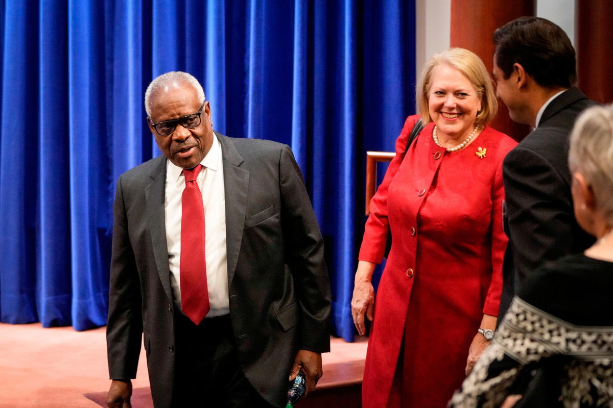 <i>Drew Angerer/Getty Images</i><br/>Associate Supreme Court Justice Clarence Thomas and his wife and conservative activist Virginia Thomas arrive at the Heritage Foundation on October 21