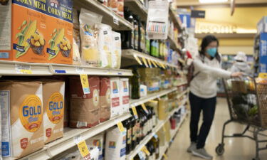 Bags of wheat flour and corn flour are on sale at a supermarket on April 9