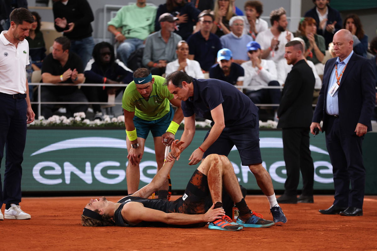 <i>Clive Brunskill/Getty Images</i><br/>Alexander Zverev of Germany receives medical attention as Rafael Nadal of Spain looks on Friday in the men's semifinal match at the French Open.
