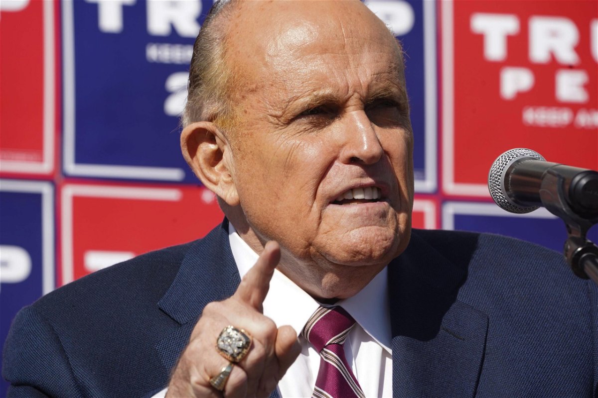 <i>BRYAN R. SMITH/AFP/Getty Images</i><br/>Rudy Giuliani speaks at a news conference in the parking lot of a landscaping company on November 7