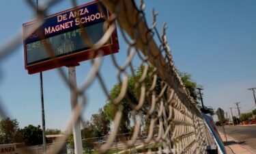 Several cities across the US are setting new temperature records. A temperature of 114 degrees is displayed on a digital sign outside De Anza Magnet School in El Centro