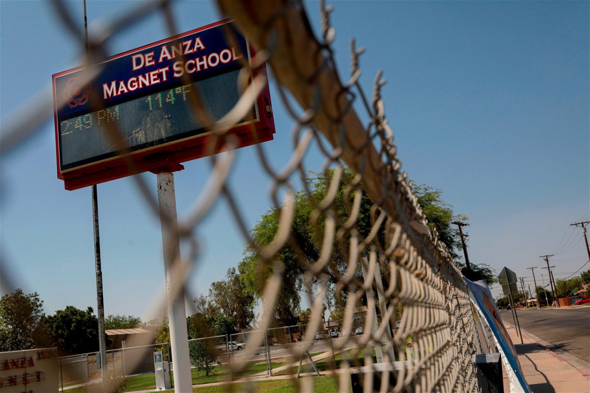 <i>Sandy Huffaker/Getty Images</i><br/>Several cities across the US are setting new temperature records. A temperature of 114 degrees is displayed on a digital sign outside De Anza Magnet School in El Centro