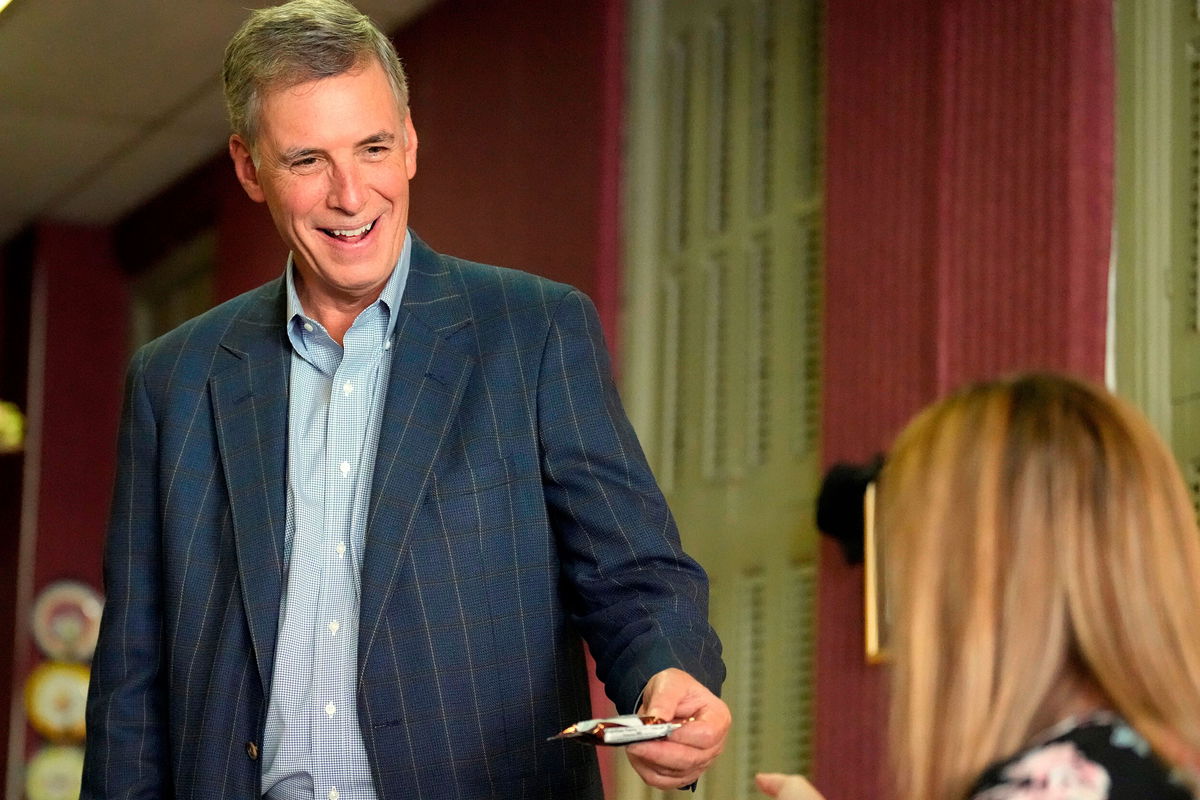 <i>Meg Kinnard/AP</i><br/>Rep. Tom Rice hands out personalized Rice Krispies treats to constituents as he stops at a restaurant in Florence