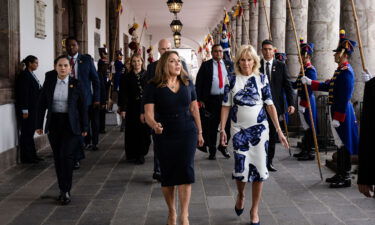First Lady Jill Biden walks with First Lady of Ecuador Maria de Lourdes Alcivar de Lasso at the Carondelet Palace in Quito