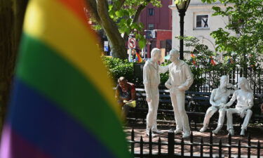 Rainbow flags and sculptures are seen at the Stonewall National Monument in New York City.