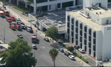 Emergency workers respond to the scene of a reported stabbing at the Encino Hospital Medical Center in Los Angeles.