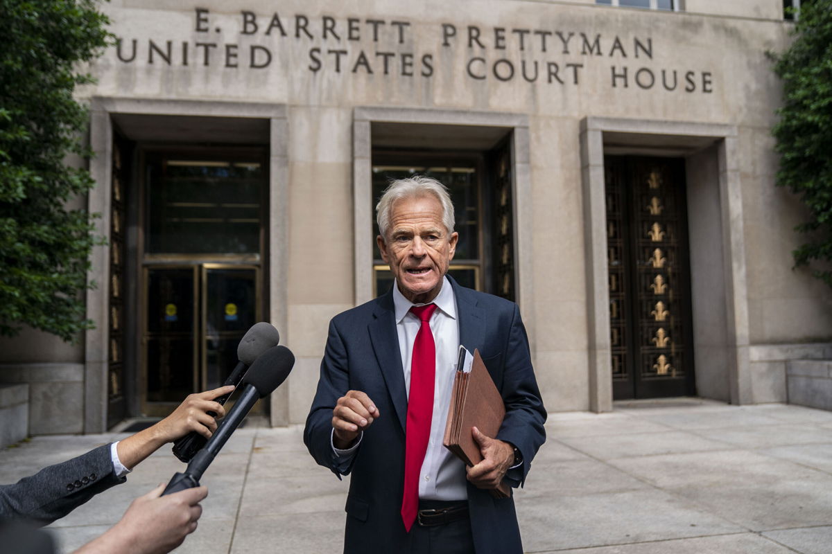 <i>Kent Nishimura/Los Angeles Times/Getty Images</i><br/>Former Trump White House Advisor Peter Navarro speaks to the media outside U.S. District Court on Friday