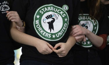 Starbucks employees and supporters react as votes are read during a union-election watch party in December 9