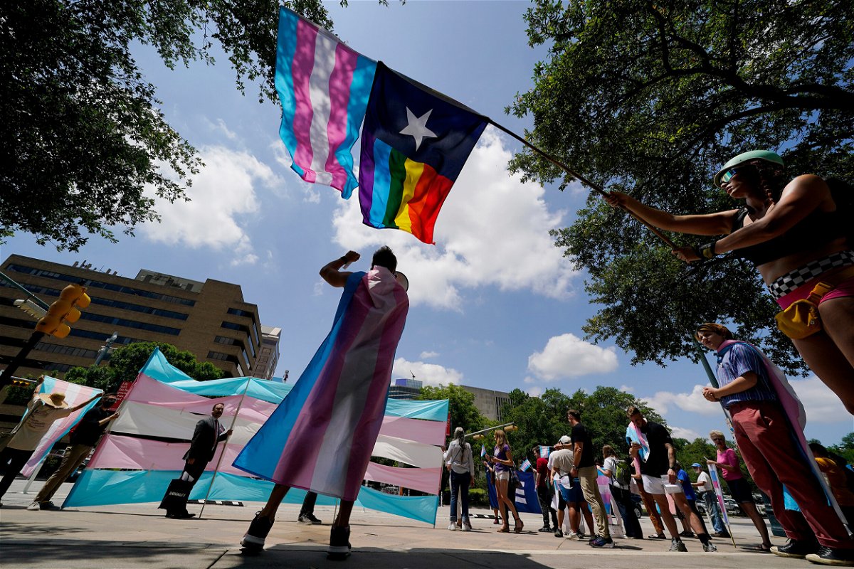 <i>Eric Gay/AP/FILE</i><br/>Demonstrators gather on the steps to the State Capitol to speak against transgender-related legislation bills being considered in the Texas Senate and Texas House on May 20