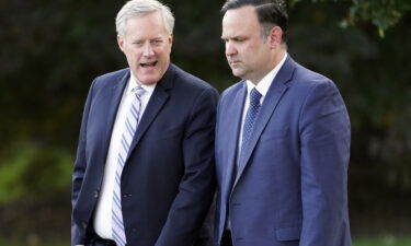 White House chief of staff Mark Meadows and White House social media director Dan Scavino walk to board Marine One on the South Lawn of the White House
