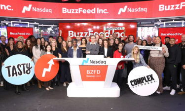 Founder and CEO of BuzzFeed Jonah H. Peretti and BuzzFeed are seen on stage as they are preparing to ring a bell during BuzzFeed Inc.'s Listing Day at Nasdaq on December 06