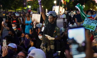 A protester raises his fist during a demonstration on May 31