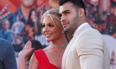Britney Spears and Sam Asghari pose at the premiere of "Once Upon a Time In Hollywood" in Los Angeles on July 22
