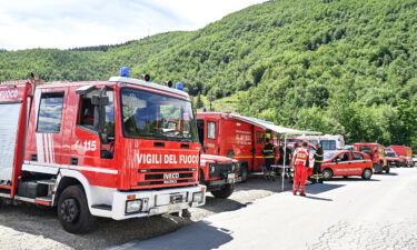 Rescue teams search for the missing helicopter on Saturday in Pievepelago