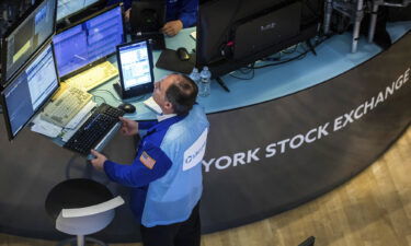 A trader works at his post on the New York Stock Exchange floor