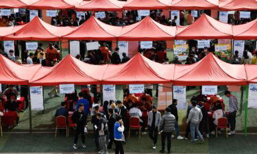 Students look for job during a campus job fair in Xining