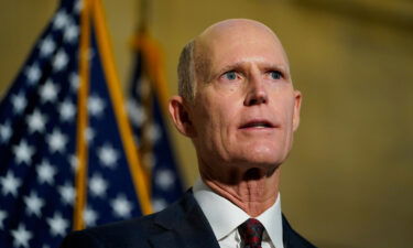 Florida Republican Sen. Rick Scott dropped his proposal requiring low-income Americans to pay at least some federal income tax in his revised agenda for the country