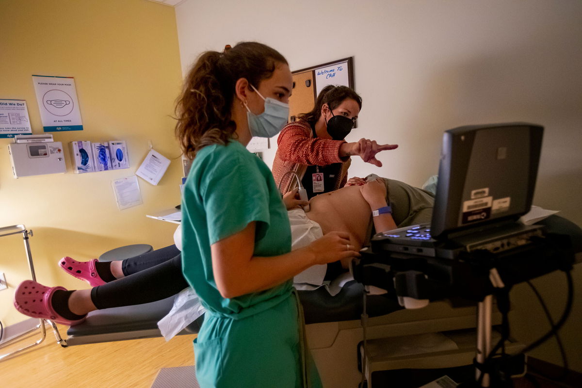 <i>Gina Ferazzi/Los Angeles Times/Getty Images</i><br/>A family physician and her resident perform an ultrasound on a 25-year-old woman the day before the Supreme Court overturned Roe v. Wade at the Center for Reproductive Health clinic on Thursday