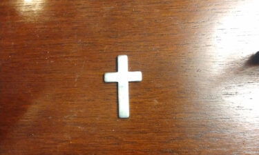 Ashlye Wilkerson keeps this silver cross as a memento from the traffic stop.