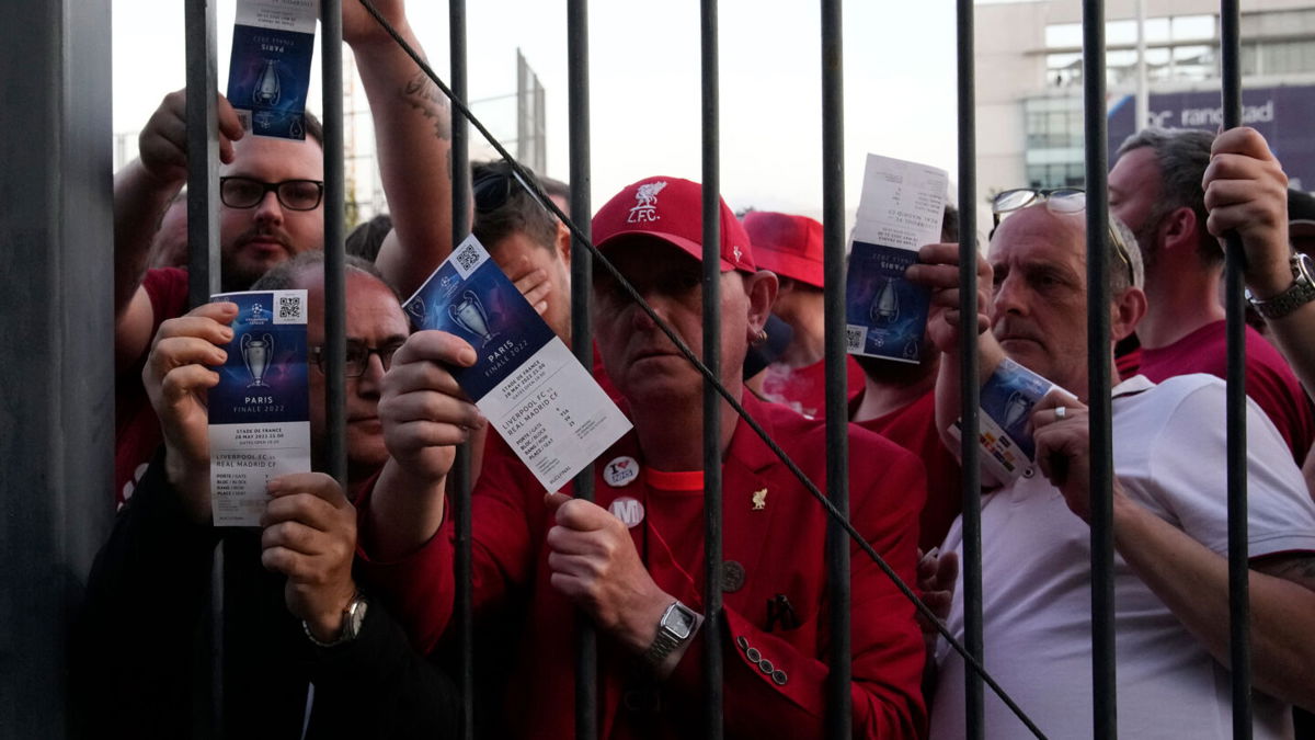 <i>Christophe Ena/AP</i><br/>Liverpool fans wait to be admitted to the Stade de France prior to the Champions League final.