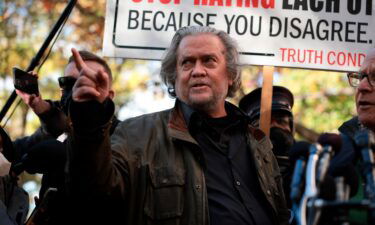 Former Trump Administration White House advisor Steve Bannon and his lawyer David Schoen speak to reporters outside of the E. Barrett Prettyman Federal District Court House on November 15
