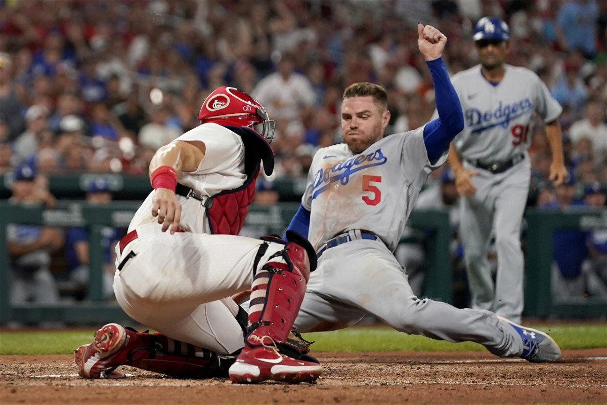 Los Angeles Dodgers' Freddie Freeman (5) is tagged out at home by St. Louis Cardinals catcher Andrew Knizner during the eighth inning of a baseball game Thursday, July 14, 2022, in St. Louis. (AP Photo/Jeff Roberson)