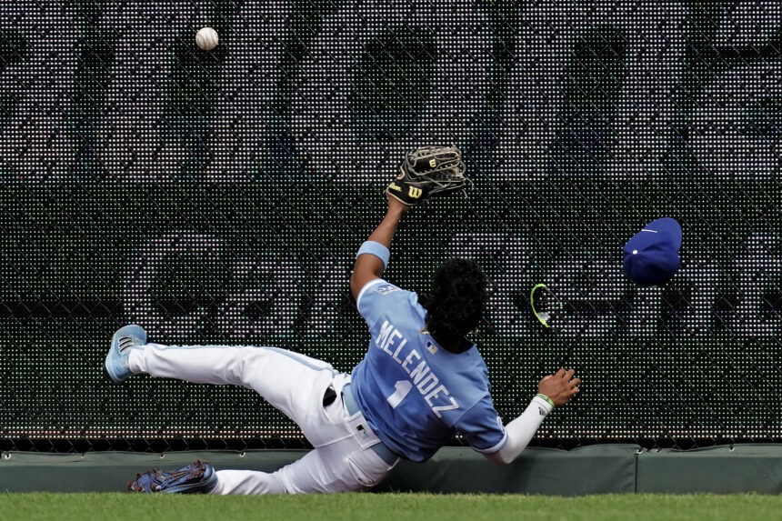 Kansas City Royals' Samad Taylor celebrates in the dugout after scoring  during the eighth inning of a baseball game against the Los Angeles Angels  Saturday, June 17, 2023, in Kansas City, Mo. (