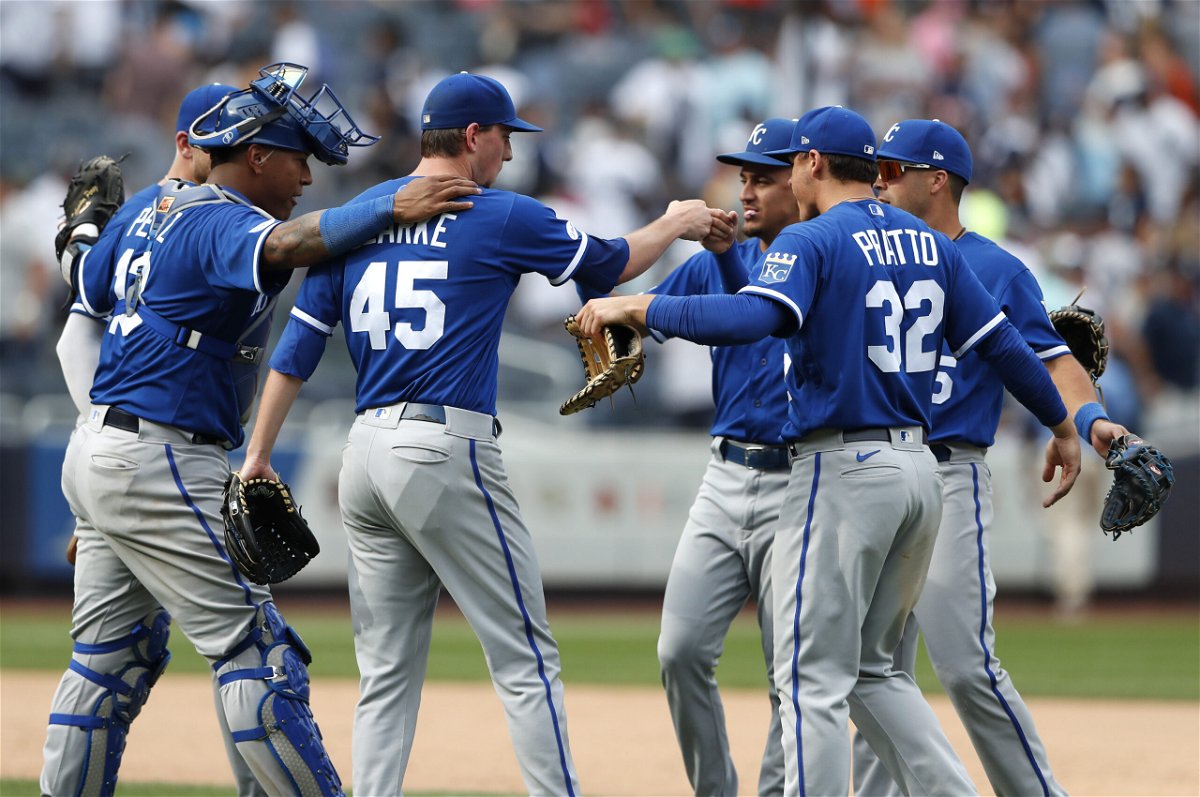 Kansas City Royals relief pitcher Taylor Clarke (45) celebrates with teammates after defeating the New York Yankees 8-6, in New York, Sunday, July 31, 2022. (AP Photo/Noah K. Murray)