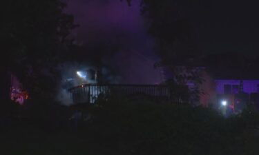 Two families were displaced in an early Tuesday morning house fire that hit two homes and injured two firefighters.