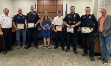 Jefferson County Sheriff Steve Anderson presented life-saving medals to Battalion Chief Jim Kelly