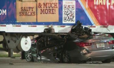 A car ended up wedged under a tractor-trailer in an overnight crash in northwest Miami-Dade.
