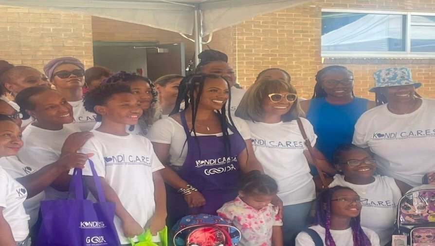 <i>WGCL</i><br/>Grammy award-winning singer and TV personality Kandi Burruss and her foundation Kandi Cares provided supplies to 500 children at the back-to-school giveaway at the Jefferson Park Recreation Center in East Point on Saturday.