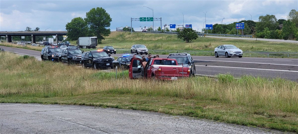Police investigate a red pickup truck involved in a chase in Columbia on Friday, July 8, 2022.