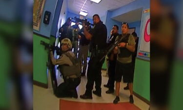 This photo released by the Texas House of Representatives Investigative Committee on the Robb Elementary School shooting shows responders positioned in the north end of a hallway at the school.