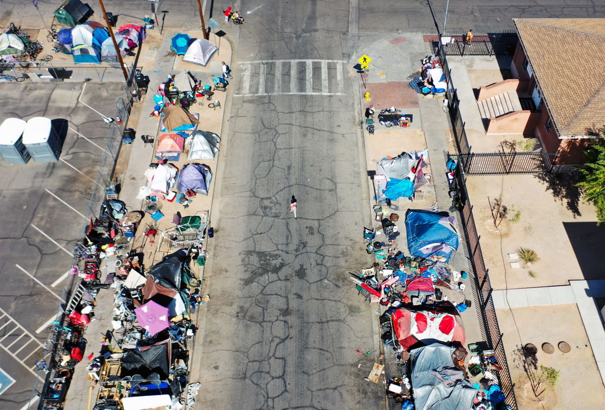 <i>Mario Tama/Getty Images</i><br/>An aerial view of people gathered near a homeless encampment on July 21 in Phoenix