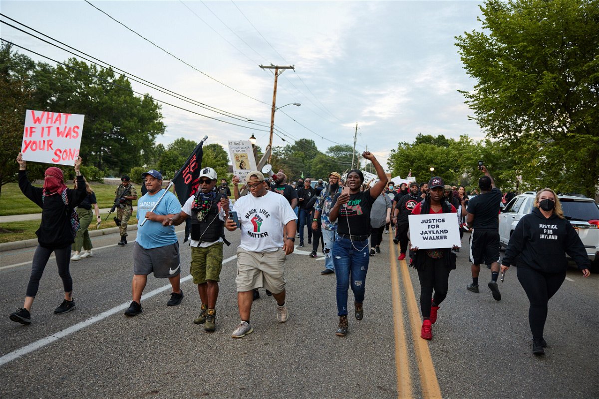 <i>Angelo Merendino/Getty Images</i><br/>Demonstrators march after a vigil in honor of Jayland Walker on July 8