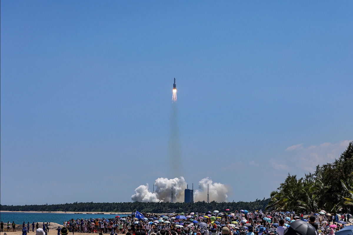 <i>Zhang Liyun/Xinhua/AP</i><br/>Large crowds of space enthusiasts watching watched China's launch of the Wentian lab module from tropical Hainan Island on a hot Sunday afternoon.