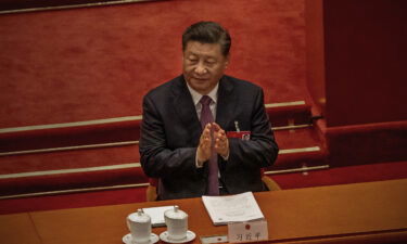 Chinese President Xi Jinping claps during the Second Plenary Session of the Fifth Session of the 13th National People's Congress on March 8 in Beijing