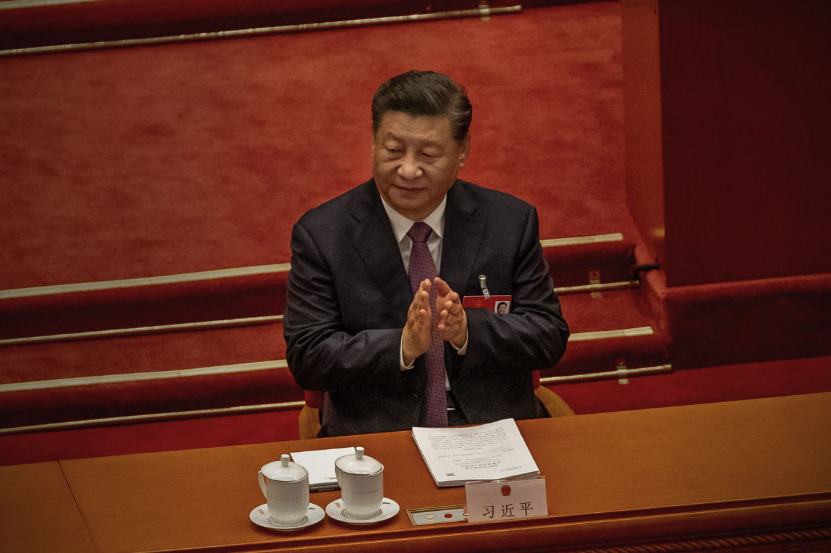 <i>Andrea Verdelli/Getty Images</i><br/>Chinese President Xi Jinping claps during the Second Plenary Session of the Fifth Session of the 13th National People's Congress on March 8 in Beijing