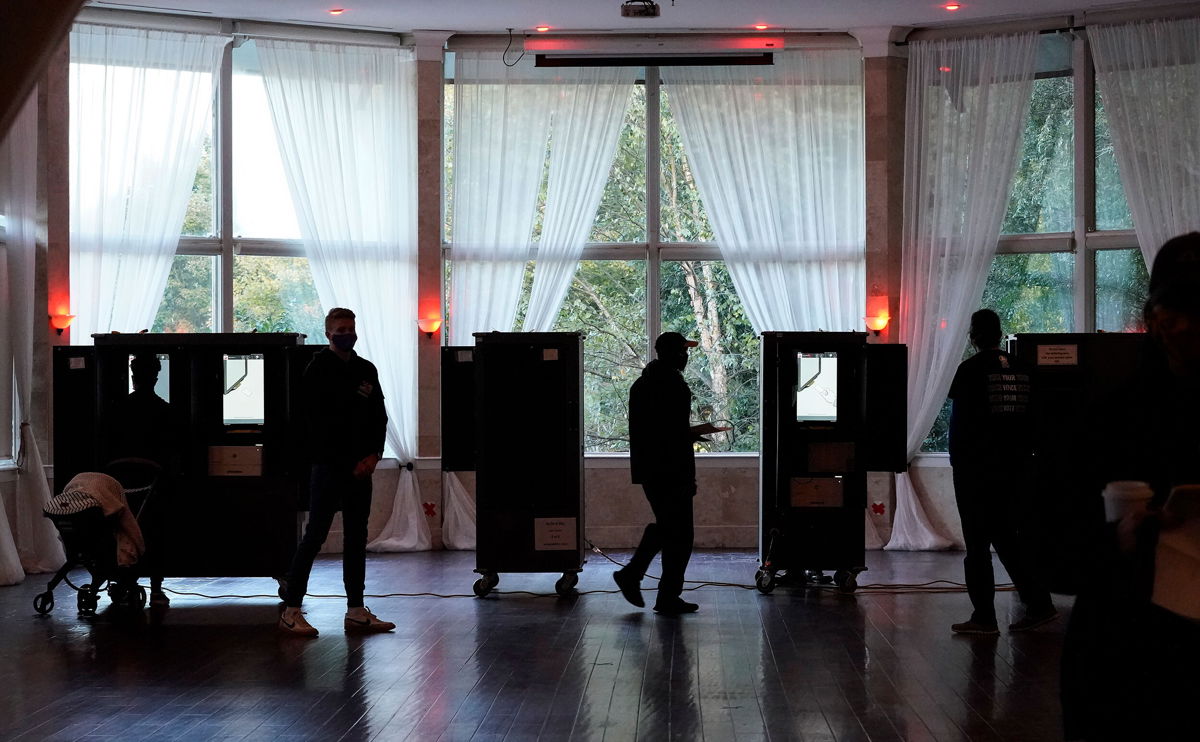 <i>Brynn Anderson/AP</i><br/>People vote on Election Day in Atlanta on November 3