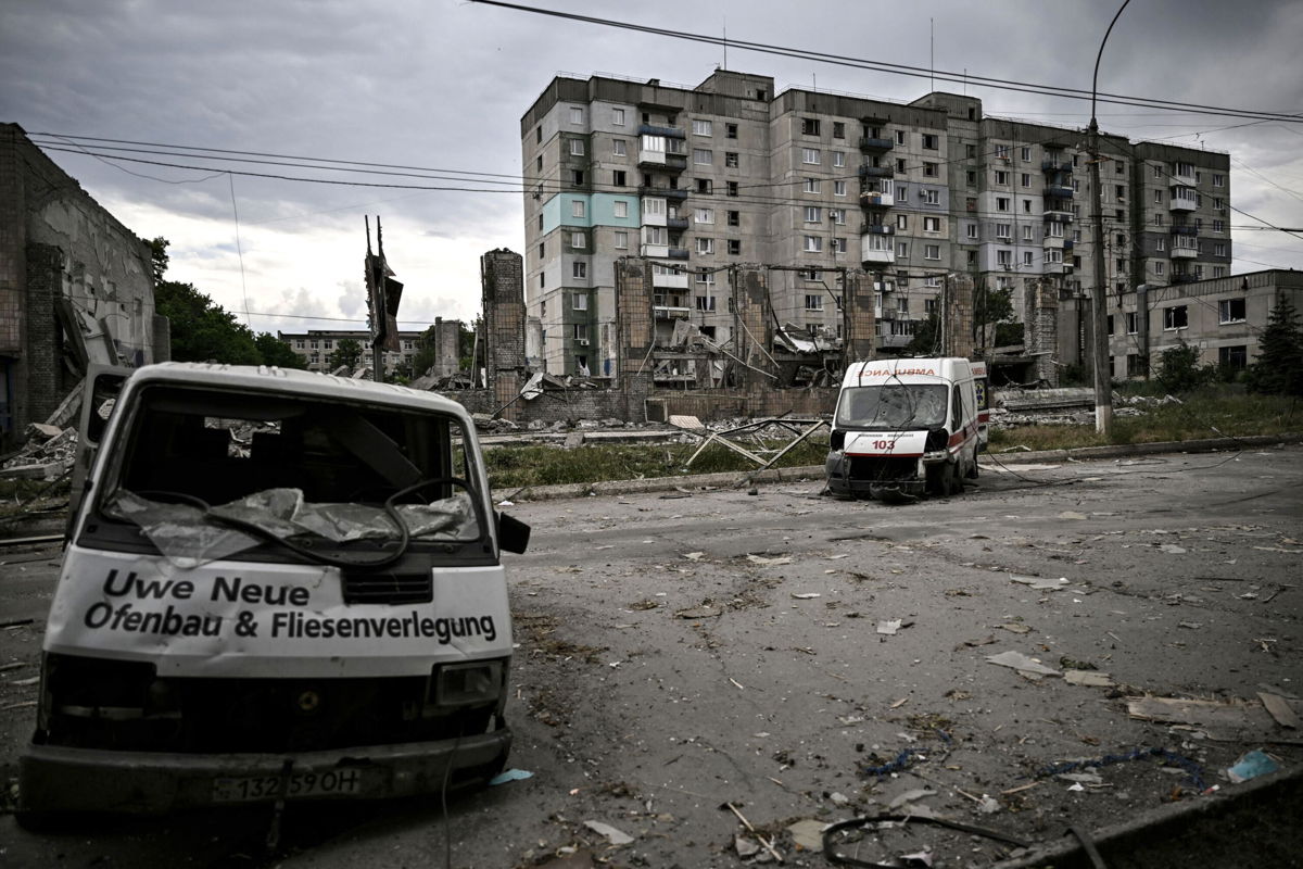 <i>Aris Messinis/AFP/Getty Images</i><br/>Destroyed vehicles are pictured in the city of Lysychansk in the eastern Ukrainian region of Donbas on June 18