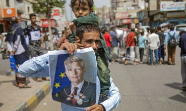 Yemeni demonstrators hold a portrait of UN special envoy Hans Grundberg during a protest demanding the end of a years-long blockade of the area imposed by Yemen's Houthi rebels on the city of Taiz